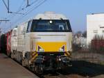 Eine Vossloh G2000BB der franzsischen Euro Cargo Rail durchfhrt den Bahnhof Antwerpen-Berchem mit einem Gterzug am Haken.