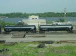Guterwagen New tank cars fresh from the factory in 2003 roll through the Burlington, Iowa yard. Mississippi River in background.