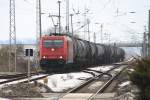 HGK 2061 (185 603-8) mit Kesselwagenzug am 23.02.2010 durch Passow ...