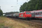 HGK Hafen - Und Guterverkehr Koln 145-CL 011 mit einem Kesselwagen-Ganzzug am 23.07.2010 durch Radbruch. Im Hintergrund ist der EN 490 nach Hamburg-Altona zu sehen, mit gut 2-st�ndiger Versp�tung.