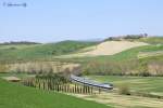 An unidentified D.445 propels Regionale train 11786 through the Tuscan hills near Ponte D`arbia, 14 April 2013
