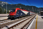 E 190 301-8 der FUC hält mit dem R 1881  MICOTRA  (Villach Hbf - Udine), im Bahnhof Carnia.