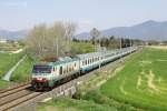 E.402 029 passes behind the airport, shortly after leaving Pisa Centrale whilst working IC657, 0810 Milano Centrale-Grosseto, 16 April 2013