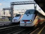22.8.2014 19:20 Zwei Frecciabianca  weißer Pfeil  der FS im Bahnhof Verona Porta Nuova.