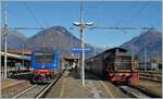 Die blaue FS Trenitalia E 464 603 steht mit einem Nahverkehrszug nach Novara in Domodossola und die FS Trentitalia D 245 2284 zieht die im Gleichstrombereich angekommene SBB Re 460 vom EXPO MILANO