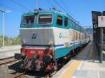 12.8.2011 14:42 FS E656-017 mit einem Expresszug (E) aus Torino Porta Nuova nach Palermo Centrale bei einem lngeren Aufendhalt im Bahnhof Patti-S.