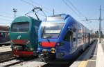 Hier links ALe506 086 als R11014 von Venezia Santa Lucia nach Udine und rechts ETR340 003 als R5716 von Venezia Santa Lucia nach Bassano del Grappa, diese beiden Triebzge standen am 12.7.2011 in Venezia Santa Lucia.