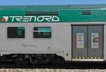 Auf jeder Tr der Wagen des Regionalzuges von Domodossola nach Mailand Werbung der Bahngesellschaft TRENORD fr die Fahrt mit der Bahn zu der in diesem Jahr stattfindenden Expo in Rho Fiera.