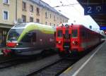 Zu sehen ist ein ETR 170 als REX 1856 nach Fortezza/Franzensfeste und daneben der MÁV Ultraschallmesszug 9160 035. Aufgenommen am 15.5.2015 im Bahnhof Lienz.