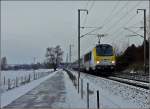 Der IR 115 Liers-Luxembourg mit der leicht verschneiten 3015 fhrt am 05.12.2010 in der Nhe von Lintgen an mir vorbei. (Hans)