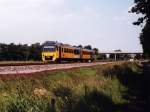 3231 mit Regionalzug 30260 Groningen-Leeuwarden bei Kollumerzwaag am 19-6-1999. Bild und scan: Date Jan de Vries.