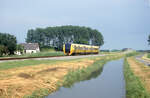 NS 3410 als Zug 6152 Arnhem - Tiel bei Echteld, 08.06.2003, 15.21u. Scanbild 8719, Fujichrome100. Siehe auch ID 1351734, gleicher Standort in 2023.