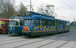 GVB 619 vom Typ 3G in Werbelackierung ( cobra ) auf Linie 12 beim Amstelbahnhof. Daneben AOM nr 282 (ex KVG, Kassel) als Partytram auf Sonderfahrt. Amsterdam, 22.04.1989. Scanbild 4895, Agfachrome CT100.