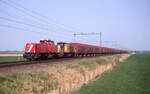 Railion 6520 und 6421 mit Opel Logistikzug 47108 (Bochum Langendreer - Antwerpen DS Oorderen) unterwegs bei Herpen am 23.04.2003. Scanbild 8682, Fujichrome100.