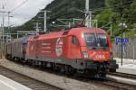 1116 143 (Montan) mit Güterzug in Bruck/Mur am 21.06.2014.