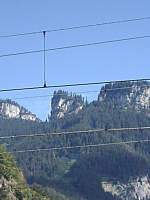 

Das ist der Blick vom Bahnhof Hohenems auf den sogenannten  Christuskopf . Mit ein bisschen Phantasie sieht man in dem Berg das   
Christusgesicht.
Wobei die Bume die Haare und den Bart des Gesichtes bilden.
Das Foto wurde am 23.8.04 gemacht.
