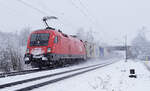 ÖBB Lokomotive 1116 185 am 08.03.2023 mit einem Cointainerzug in Lintorf.