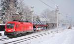 1016 007 mit gut ausgelastetem Gterzug Richtung Sden bei Salzburg-Sd, Februar 2012.