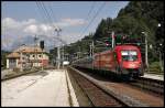 1116 097 schiebt den REX 1509  betriebliche-altersvorsorge.at , Innsbruck Hbf - Schwarzach-St.Veit, aus dem Bahnhof Kitzbhel.