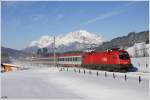 1116.054 ist mit IC 515 von Innsbruck nach Graz unterwegs und konnte im verschneiten Fieberbrunn (geschtzt 35cm Neuschnee) aufgenommen werden, 29.01.2011