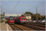 Regional- und Fernverkehr im Bahnhof Tullnerbach-Pressbaum: BB IC 646 (mit der  Rail Cargo Hungaria  1116 017) bei der planmigen berholung des R 2032.