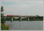 EC 74  Alois Negrelli  von Wien nach Prag am 21.7.2006 bei der berquerung der Donau in der Lobau bespannt mit 1116.