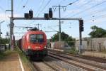 1116 112-4 fährt am 15.August 2014 durch die Hst. Haidestrasse.