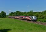 1116 249 mit einem umgeleiteten Railjet am 08.06.2013 bei München-Feldmoching.