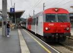 Hier ist die S-Bahn 80-73 035-2 nach Salzburg,die von 1144 021 geschoben wurde. Am 17.08.2010 in St.Johann .