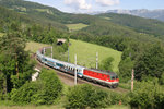 Die im besten Zustand befindliche 1144.083 fährt mit EC-151 beim Steinbauer-Tunnel am Eichberg bergwärts. 8.6.16