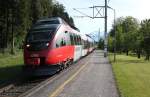 4024 003-8 fhrt in die Haltestelle Feldkirch Gisingen ein von Buchs kommend auf der Fahrt nach Feldkirch, spter Nachmittag, Mai 2012 