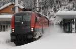 1116 214 fhrt am 04.01.12 mit einem Railjet aus Wien nach Bregenz durch den Bahnhof Langen am Arlberg.