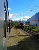 Beim Kreuzungsaufenthalt im Bahnhof Dölsach trifft Alt auf Neu! Rechts zu sehen ist die entgegenkommende 1116 243-7 mit railjet 533 + 1116 113-2 mit D 15533 (Wien Hbf -Lienz) und links der SR 14843 (Lienz - Spittal-Millstättersee) gezogen von 93.1332 und geschoben von 1245 005-2. Aufgenommen am 20.9.2015 