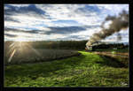 Der Abendsonne entgegen, fährt die 764 411R mit dem letzten Dampf bespannten Flascherlzug der Saison, von Preding nach Stainz.