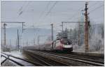 1116 249 mit dem RJ 653 von Wien nach Graz bei der Durchfahrt in Eichberg auf der Semmering Nordrampe. 6.1.2016