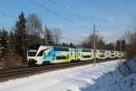 Eine Westbahn Garnitur ist am 10.02.13 auf dem Weg nach Salzburg und ist gerade kurz vor dem Ziel der Reise durch den Bahnhof Hallwang-Elixhausen gefahren.