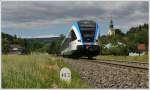 5063 008 am 17.5.2012 als Sonderzug R 4366 von Wies-Eibiswald nach Gleinsttten, aufgenommen kurz nach der Haltestelle Wies-Markt mit Blick auf die Pfarrkirche von Wies.