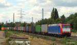 OHE Osthannoversche Eisenbahnen AG 185 CL-003 der OHE kommt am 24.07.10 mit einem Containerzug aus Hamburg-Waltershof durch Hamburg-Unterelbe gefahren und wird gleich Hamburg-Harburg durchfahren.