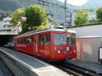 RB Rigi Bahnen RB - Im Bahnhof Vitznau ein G�terzug mit dem Triebwagen Bhe 2/4 5 und G�terwagen FU 1 sowie einem Flachwagen unterwegs am 07.09.2009