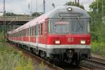 Die 110 415-7 schiebt ...  Eric Otten 30.07.2011