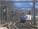 re-4-4-iii-re-430 Re 4/4 III 11355 rauscht mit einem G�terzug durch Maienfeld. (22.12.2009)