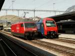 Re460 040-9 und Re450 063-3 am 10.07.10 im Bhf.Chur  ...