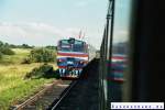 Begegnung des normalspurigen deutschen  Classic Courier  mit einem breitspurigen Dieseltriebzug DR1 auf der Strecke Mamonovo (Heiligenbeil) - Kaliningrad (Knigsberg) am 02.08.2005 in der Nhe des