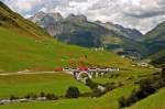 Eine unbekannte HGe 4/4 II der MGB mit dem  Glacier Express  hat am 09.08.09 vor einigen Minuten Station in Andermatt gemacht und befindet sich nun auf dem Weg nach Zermatt.