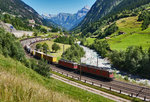 Eine Re 10/10, bestehend aus den Lokomotiven Re 6/6 11668  Stein-Säckingen  und Re 4/4 II 11335, donnert mit einem Güterzug in der Wattinger Kurve den Gotthard hinauf.
Aufgenommen am 19.7.2016. Schubhilfe leistete Re 4/4 II 11269.