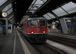 SBB: Kurzaufenthalt in Zürich HB bei Regen am 5. November 2017.
Re 4/4 II 11128 auf Rangierfahrt. Sie hat den Zug mit den Wagen aus Tschechien nach Zürich HB gebracht.
Foto: Walter Ruetsch 