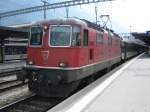 Re 4/4 II 11154 mit RE 3834 im Bahnhof Chur, 04.09.2010.