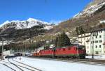 11279 & 11617 pass Airolo whilst working train 67767 Huntwangen-Wil - Sigirino holcim hoppers, 2 Feb 2016