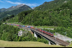 Ein mit Re 10/10 bespannter Güterzug von SBB Cargo fährt am 10. Juni 2016 über die Intschireussbrücke in Richtung Erstfeld. <br>
Die Fotostelle ist übrigens mit dem ÖV super erschlossen: Die Bushaltestelle befindet sich direkt am andern Ende der Brücke, durch die ein Wanderweg mit Gitterboden führt (nichts für Leute mit Höhenangst!).