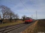 Re 460 065-6 ''Rotsee'' am 27.2.2010 zwischen Attikon und Gundetswil mit einem IR nach Biel.